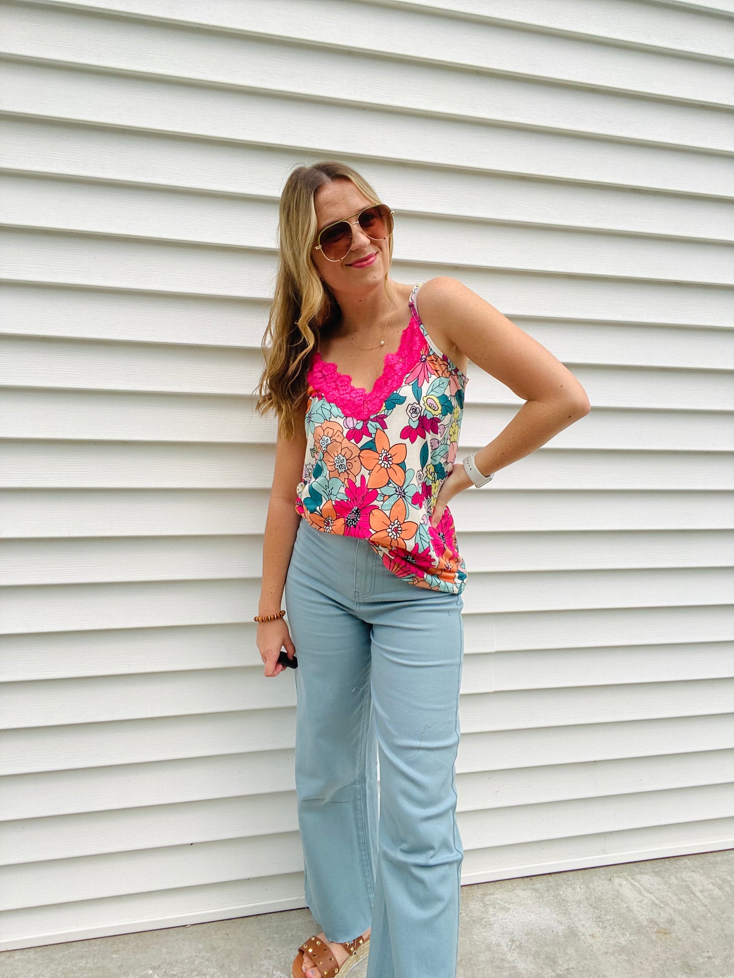 Look summer-ready in this light and flowy Vibrant Floral Lace Accent Tank. With its slightly oversized fit and beautiful hot pink lace detail and floral design, this tank is perfect for any warm-weather occasion. Enjoy the style and comfort of this timeless piece.