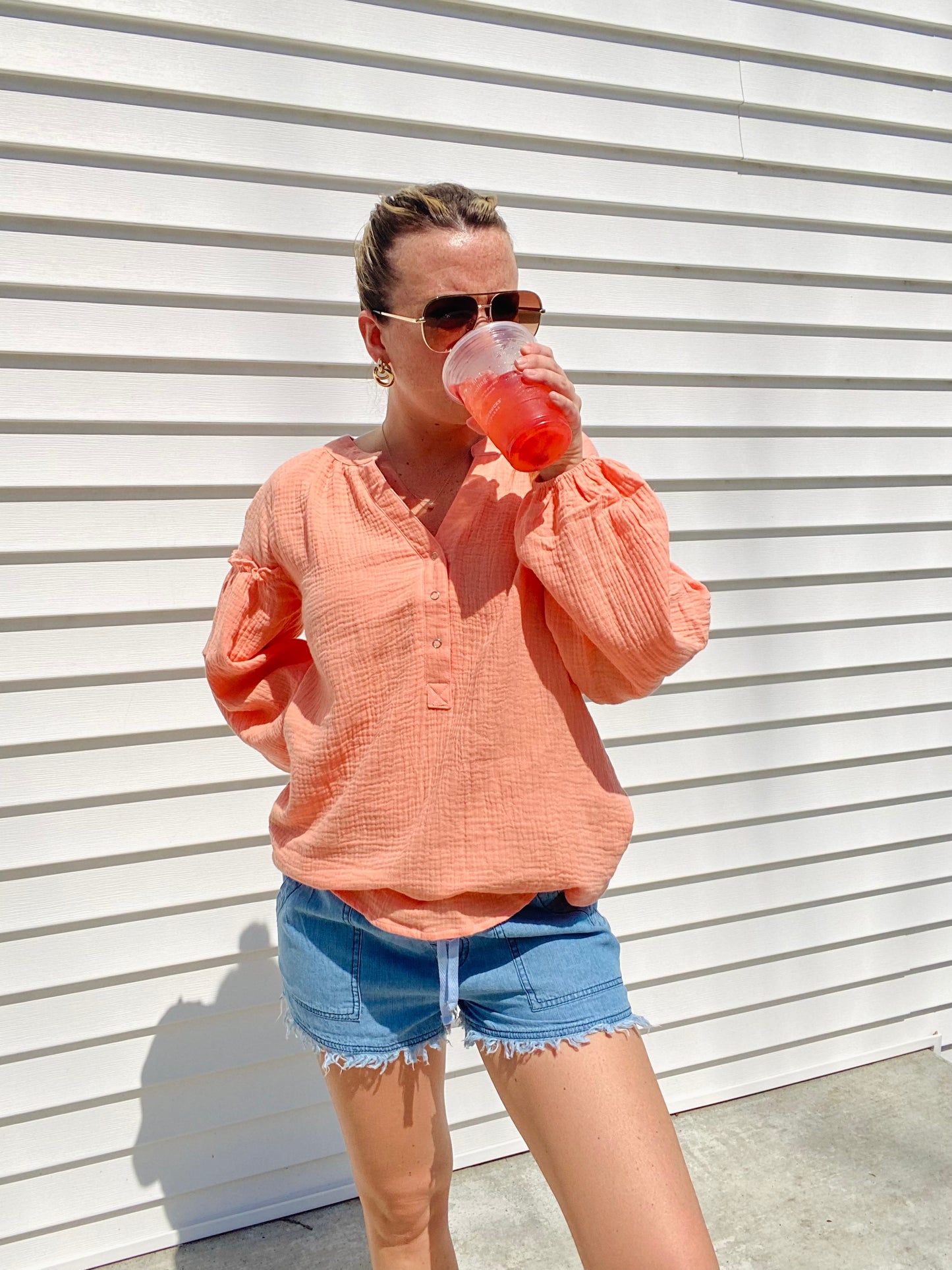 The Coral Love Gauzy Crinkle Top is the perfect addition to your wardrobe. Featuring casual balloon sleeves and functioning buttons, this top is ideal for achieving a relaxed yet stylish look. Wear it with denim and sandals for an effortless yet cute outfit.