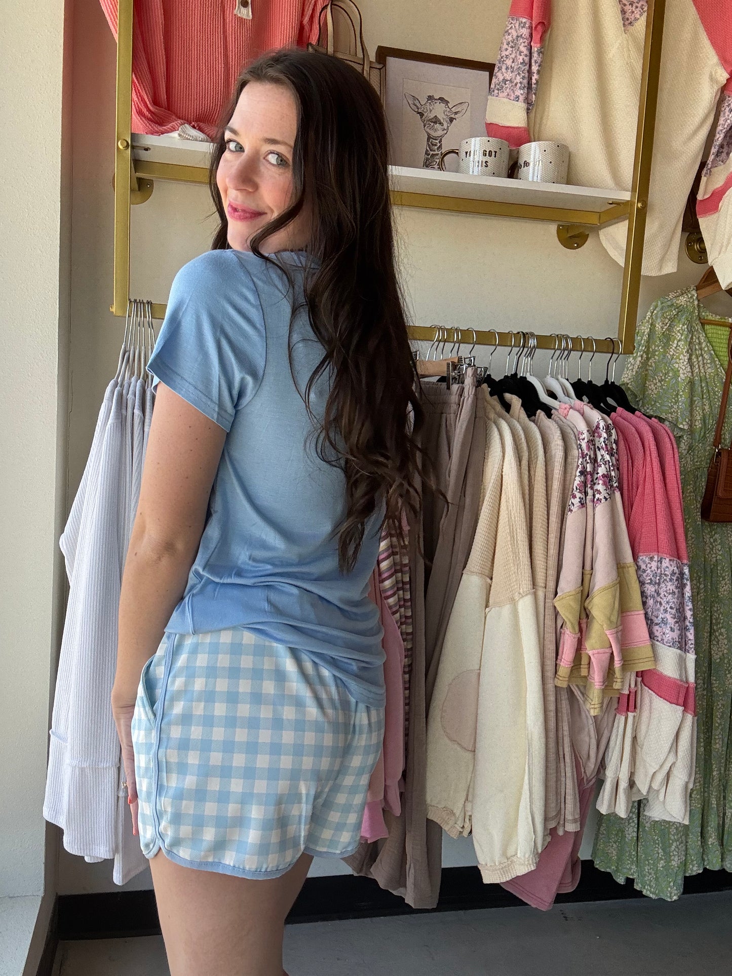 We know we're always on the lookout for a good, comfy basic! This basic tee is definitely one of those pieces! It's comfy and a perfect fit that makes it so easy to wear and the colors make styling and layering it a breeze! These top features short sleeves, a V-neck, and a rounded hemline. 