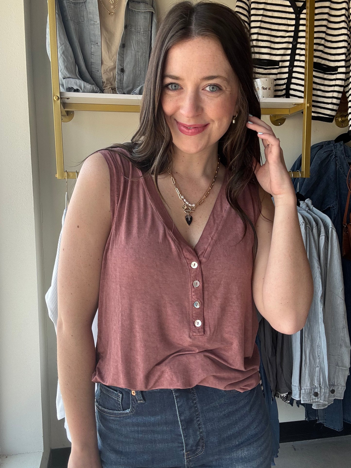 Be prepared for a great time under the sun with our Brick V Neck Button Tank. This sleeveless V-neck henley top is ideal for casual outings and is made from a comfy knit fabric. The addition of button detailing gives it a charming touch.