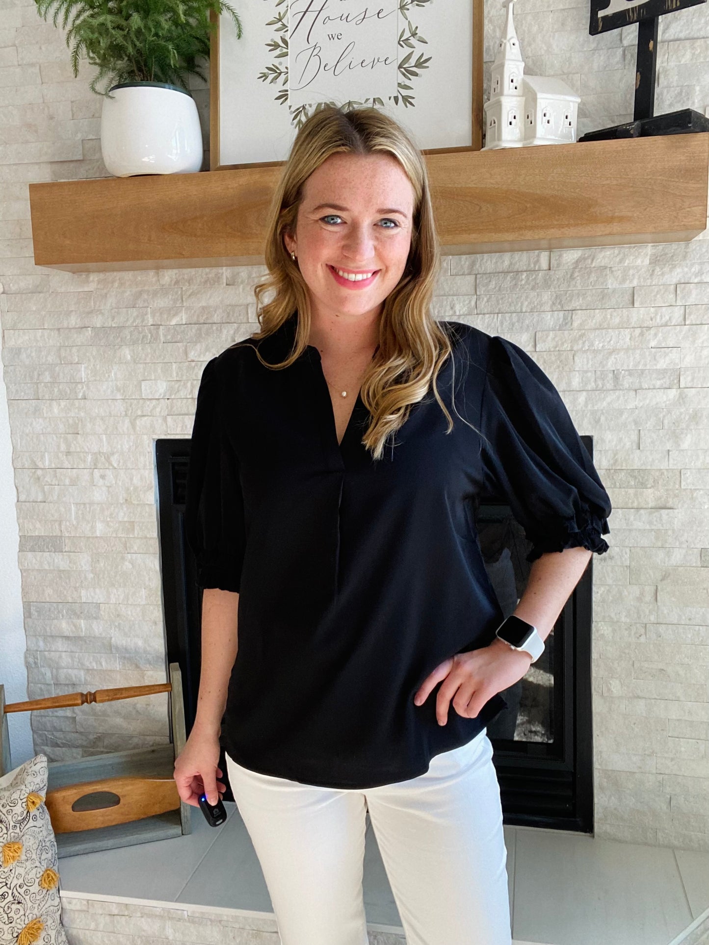 This Black Smocked Sleeve V Neck Blouse is perfect for any occasion. Crafted from high quality fabric, it features a flattering v neckline and black half sleeve. Its versatile design pairs well with white denim for a chic and timeless style.