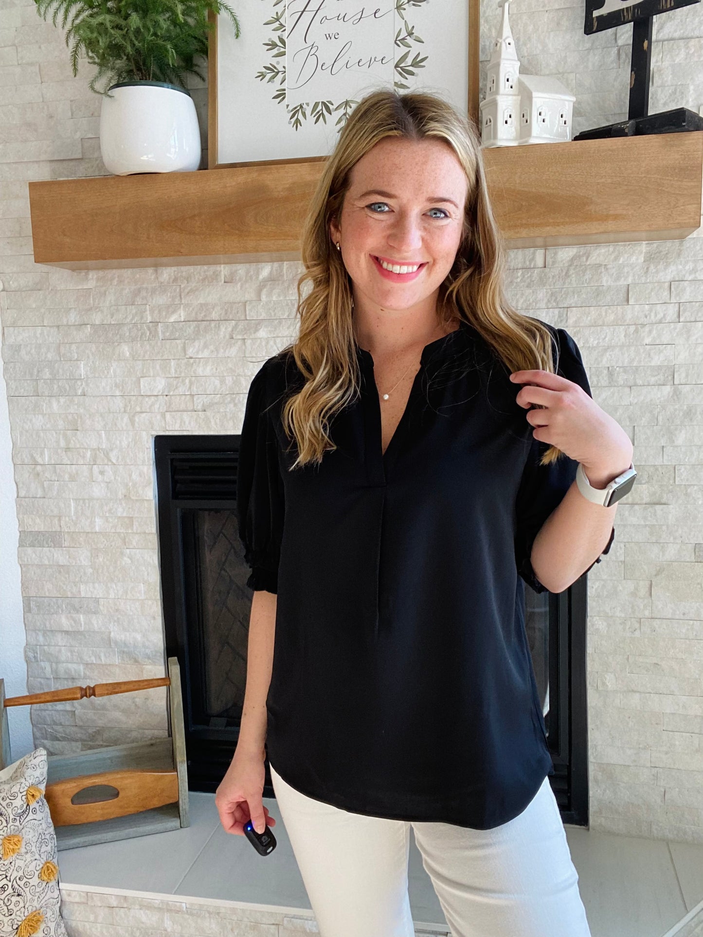 This Black Smocked Sleeve V Neck Blouse is perfect for any occasion. Crafted from high quality fabric, it features a flattering v neckline and black half sleeve. Its versatile design pairs well with white denim for a chic and timeless style.