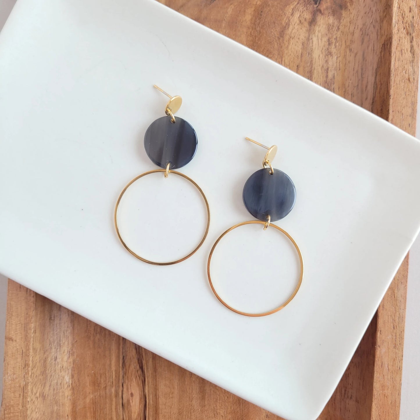Sadie is a statement dangle style that features a large gold charm for a hoop look! You'll get a perfect pop of color from the acrylic charms. 18k gold-plated stainless steel posts and charms Lightweight and durable acrylic charms in Silver