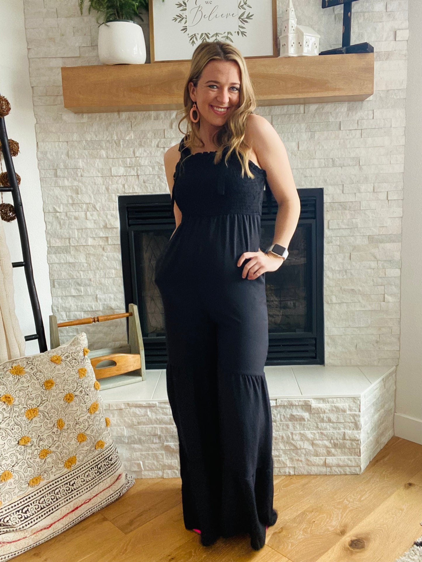 This Black Tiered Wide Leg Jumpsuit provides comfort and style. Made from a comfy fabric with a wide leg detail, you'll be ready for any occasion with this women's pant jumpsuit. Complete the look with a jean jacket and some fun sandals for a stylish, comfortable outfit.