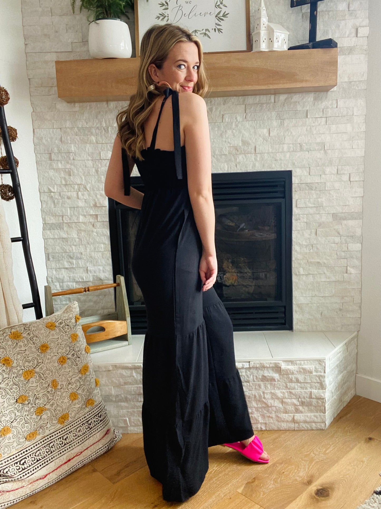 This Black Tiered Wide Leg Jumpsuit provides comfort and style. Made from a comfy fabric with a wide leg detail, you'll be ready for any occasion with this women's pant jumpsuit. Complete the look with a jean jacket and some fun sandals for a stylish, comfortable outfit.