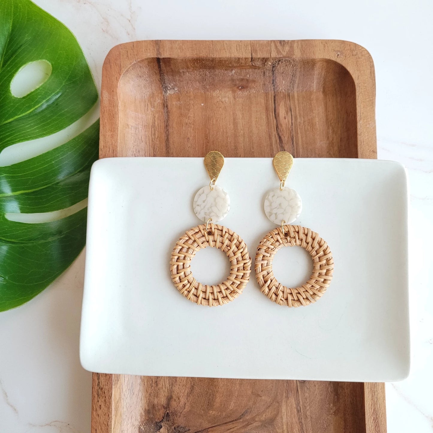 Bring a little bit of resort wear glam to your everyday style with these lightweight, rattan earrings. We've hooked you up with the perfect statement earrings with a trendy twist on our classic rattan look. The gold accents and acrylic only add to their luxurious feel and make them perfect for pairing with any outfit.