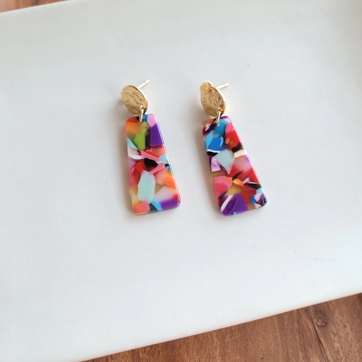 Our Mia Mini Earrings feature a fun pop of color with gold stud accents. These dainty earrings make the perfect finishing touch to any outfit, while still being small and delicate enough to wear every day.