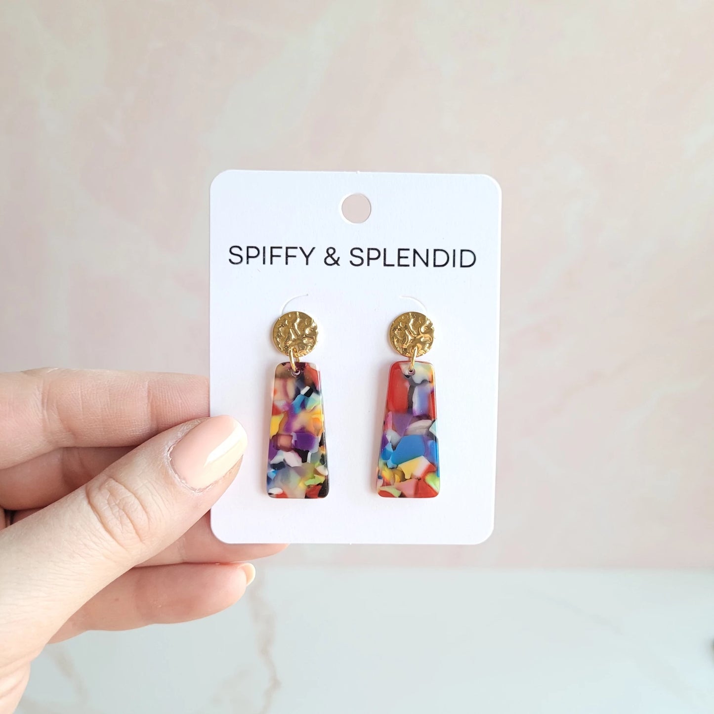 Our Mia Mini Earrings feature a fun pop of color with gold stud accents. These dainty earrings make the perfect finishing touch to any outfit, while still being small and delicate enough to wear every day.