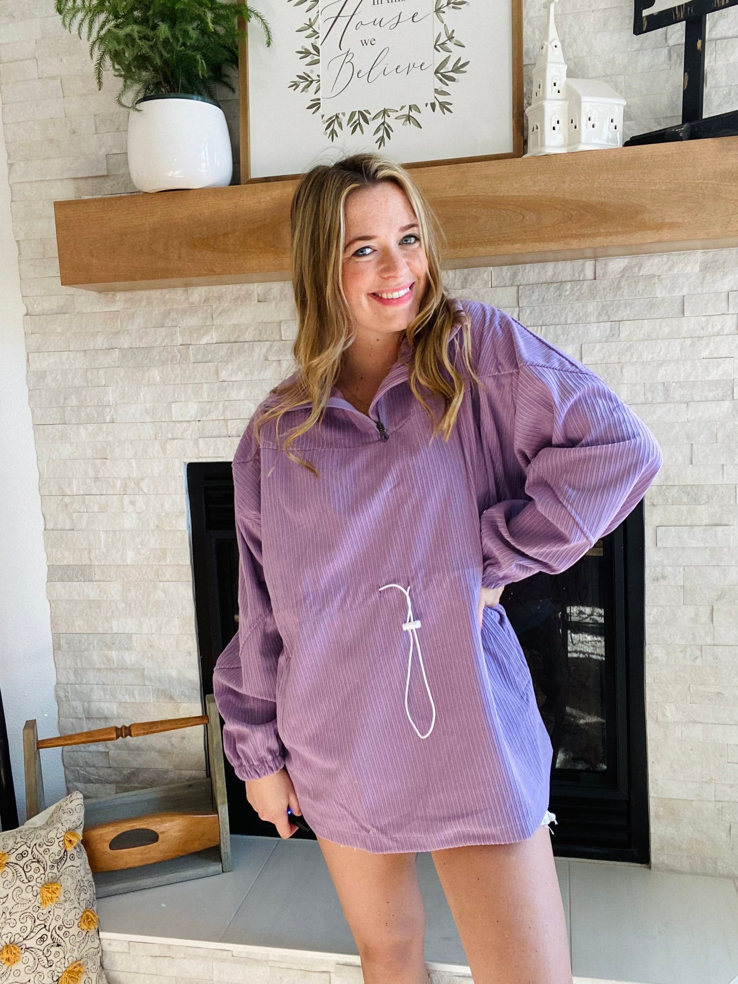 Stay warm and cozy outdoors with the Purple Toggle Tie Pullover. Constructed of durable corduroy and featuring a functional zip collar and pocketed design, this sweater is perfect for both camping and hiking. With unique diagonal seam embellishments and toggle tie drawings, you'll stand out in the camping crowd while looking your bes