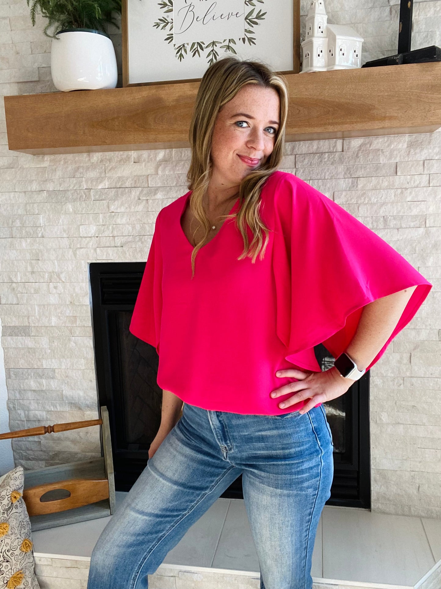 Look your best in the office this summer with the Rose Flounce Bell Sleeve Blouse. The contemporary silhouette features a distinctive bell sleeve and neon pink hue, perfect for making a statement! This style pairs effortlessly with denim and black pants, making it a versatile addition to your wardrobe. Look sharp and stay cool this season.