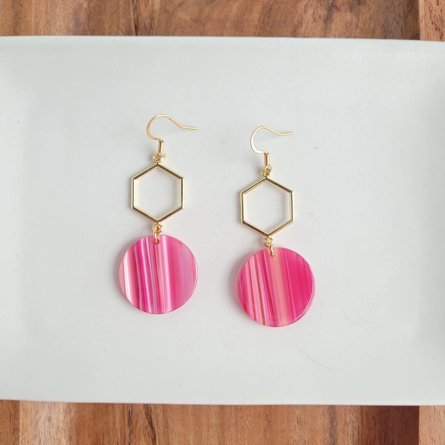 Flaunt your sophistication with a perfect pair of Layla Earrings! Our gold hexagon accent and beautiful acrylic will instantly elevate any outfit - getting you ready to take on the day like a boss. Put ‘em on, and watch the compliments roll in! (And you thought hexagons were just for math class.)