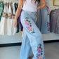 Blakeley

Designed in a soft light wash with a structured feel, these delicately floral embroidered jeans are an absolute must have. The wide-leg, slight barrel shape silhouette gives you that effortless laid-back design &nbsp;

FIT: high rise, stretch- wide leg, slight barrel.

FABRIC: 99% COTTON 1% SPANDEX