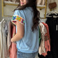Crafted from lightweight French terry, the Light Blue Embroidered Sleeve Top offers both comfort and refined style. Its classic crew neck pairs seamlessly with batwing sleeves, which are accented by a delicate floral crochet detail at the edges. This subtle embellishment elevates the design, making it a versatile piece that combines timeless elegance with a distinctive touch. 