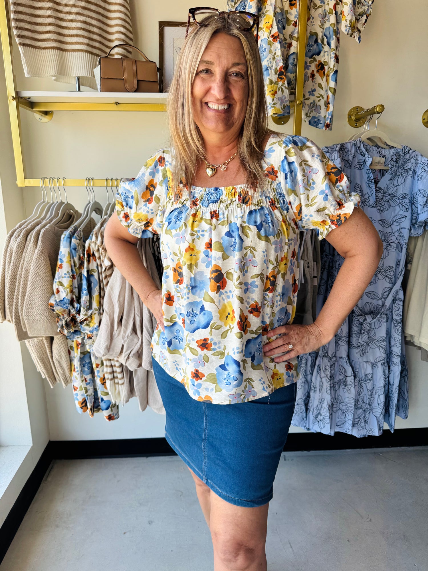 Floral cream top paired with a denim skirt
