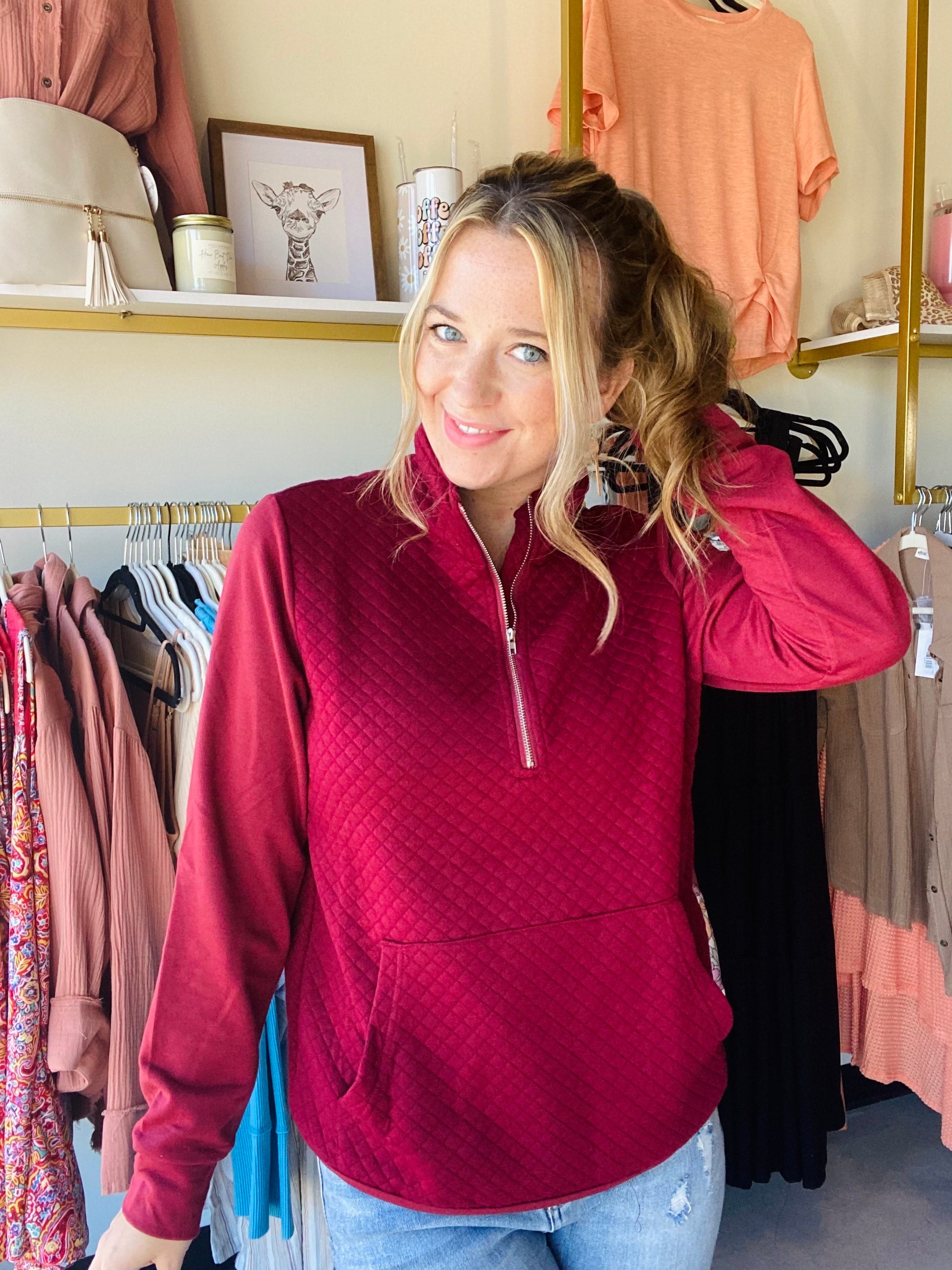 The Wine Quilted Quarter Zip is a stylish and versatile choice for any wardrobe. A richly-colored deep berry hue is complemented by a functioning zipper and a convenient kangaroo pocket. It's a great option for dressing up or down.