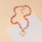 Pearlescent Heart Pendant Marbled Bead Necklace