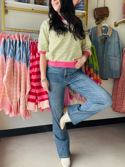 Green & hot pink striped top with boot leg mid-rise denim jeans