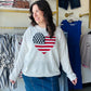 Celebrate the USA in ultimate comfort with this iconic heart-shaped flag knit. Featuring a cozy oversized fit and premium mid-weight fabric, it’s your new go-to for patriotic style all year long.