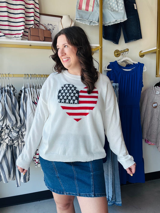 Celebrate the USA in ultimate comfort with this iconic heart-shaped flag knit. Featuring a cozy oversized fit and premium mid-weight fabric, it’s your new go-to for patriotic style all year long.