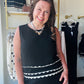 Anniewear

Elevate your everyday wardrobe with this sophisticated high-neck tank featuring striking contrast scallop trim. The elegant keyhole back adds a polished touch to this timeless, breathable silhouette. Perfect for layering under a blazer or shining solo as a modern statement piece.

Elegant high neck for modern style.
Chic scallop trim adds feminine detail.
Breathable fabric for all-day comfort.
Sophisticated keyhole back for subtle flair.
Versatile black hue matches everything.
Seamlessly transiti