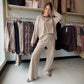 Meet your excuse to linger over that second cup of coffee. The Jersey Stripe Brushed Lounge Set by Anniewear pairs a relaxed long-sleeve pullover with matching wide-leg pants for an effortlessly coordinated look. Soft, brushed stretch jersey brings the cozy feel, while thin stripes and contrast neck trim add a little polish to your downtime.

Whether you're easing into a quiet morning, settling in for movie night, or slipping on sneakers for a casual outing, this two-piece set makes getting dressed beautifu