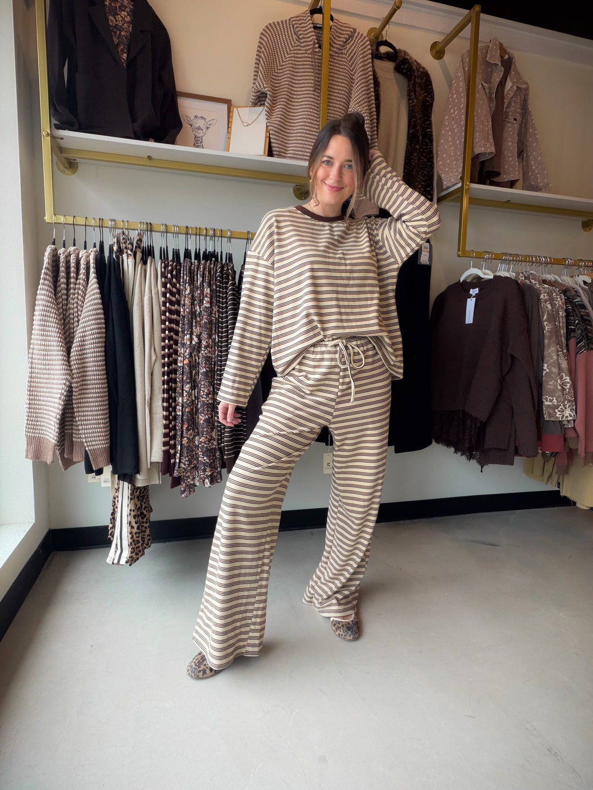 Meet your excuse to linger over that second cup of coffee. The Jersey Stripe Brushed Lounge Set by Anniewear pairs a relaxed long-sleeve pullover with matching wide-leg pants for an effortlessly coordinated look. Soft, brushed stretch jersey brings the cozy feel, while thin stripes and contrast neck trim add a little polish to your downtime.

Whether you're easing into a quiet morning, settling in for movie night, or slipping on sneakers for a casual outing, this two-piece set makes getting dressed beautifu