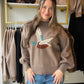 A Little Outdoorsy Charm, a Lot to Love

Meet the sweater that brings a playful twist to your cozy-day lineup. Our Mallard Balloon Sleeve Sweater by Anniewear features a flying mallard knit design across the front, giving this easy pullover a personality all its own. The soft knit and relaxed, loose silhouette make it an inviting pick for slow mornings, coffee dates, and crisp afternoons spent browsing your favorite shops.

A classic round neckline keeps the look simple, while dropped shoulders and long bal