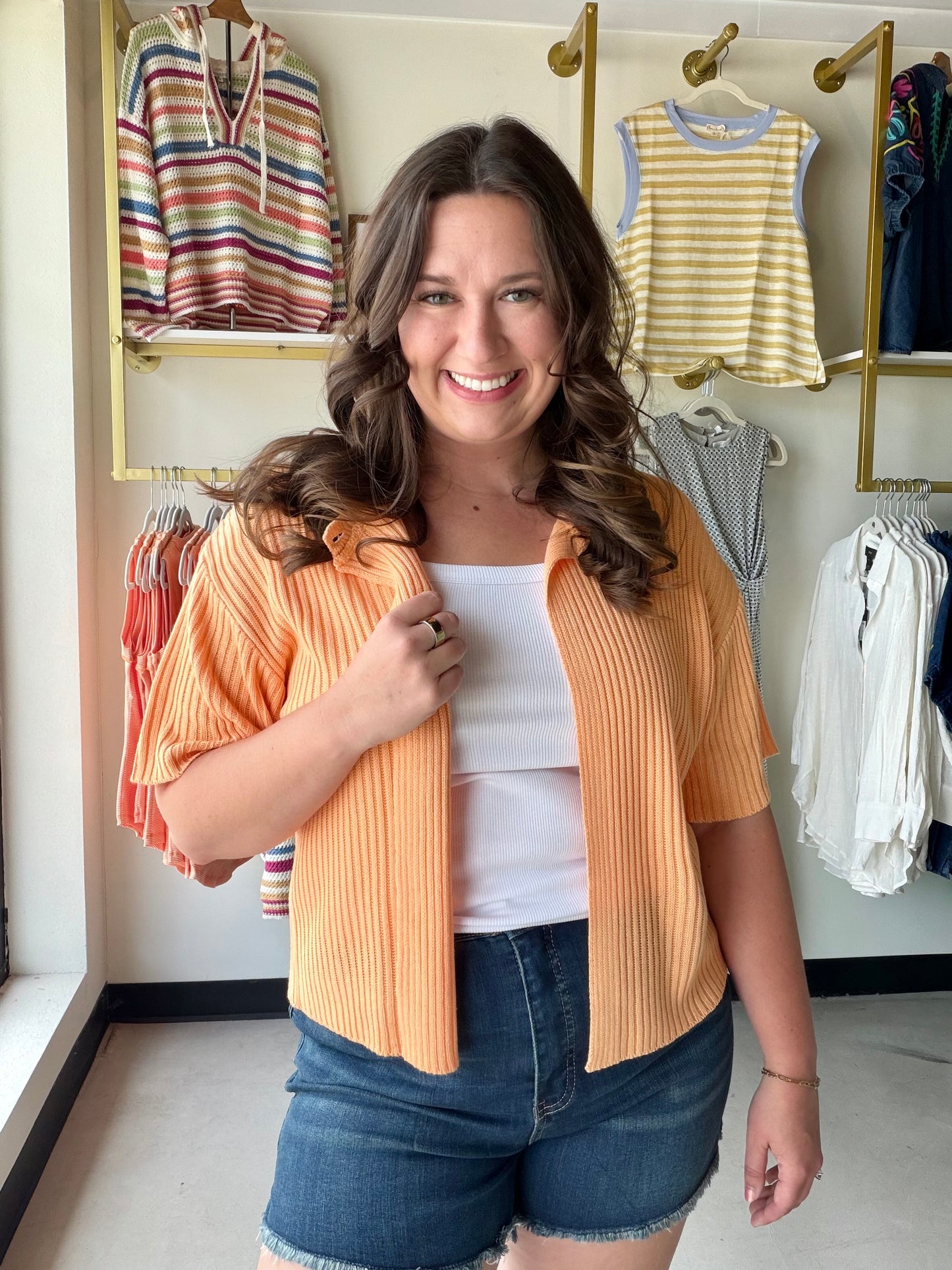 Sweet, warm, and endlessly wearable. The Apricot Short Sleeve Cardigan by Sunday Edition is a lightweight sweater cardigan in a soft apricot hue that pairs with practically everything in your closet. The button-front closure and half-sleeve cut give it a polished, put-together look that works from the office to a weekend outing.

Layer it over a tank or slip dress for an effortless warm-weather outfit, or toss it on as a light cover-up on breezy evenings.

Button-front closure
Short (half) sleeve
Lightweigh