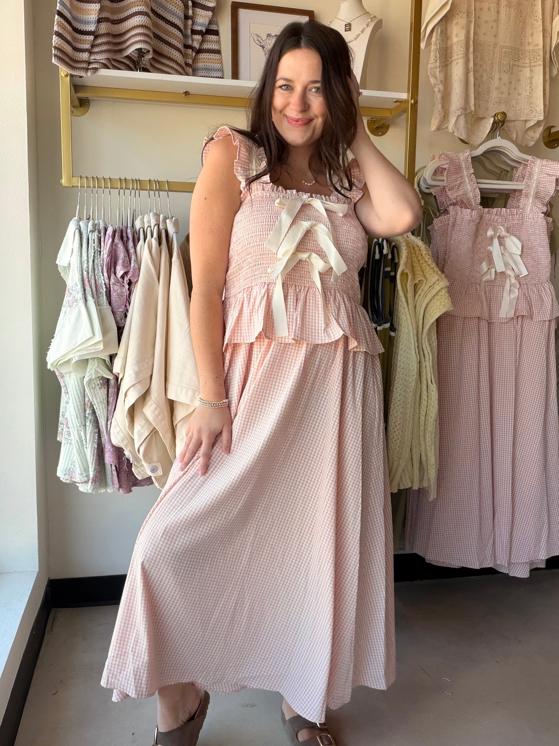 Blush Gingham Smocked Midi Dress

Romantic, feminine, and made for the moments worth dressing up for. This dreamy midi dress features a smocked bodice, delicate lace tape trim, and ruffled bow details that make it feel effortlessly special. The classic gingham print in blush tones keeps it fresh and versatile — perfect for brunch, a garden party, or a summer date night.

Smocked bodice for a flattering, stretchy fit
Lace tape trim with ruffled bow details
Classic gingham print in blush
Midi length
Fully lin
