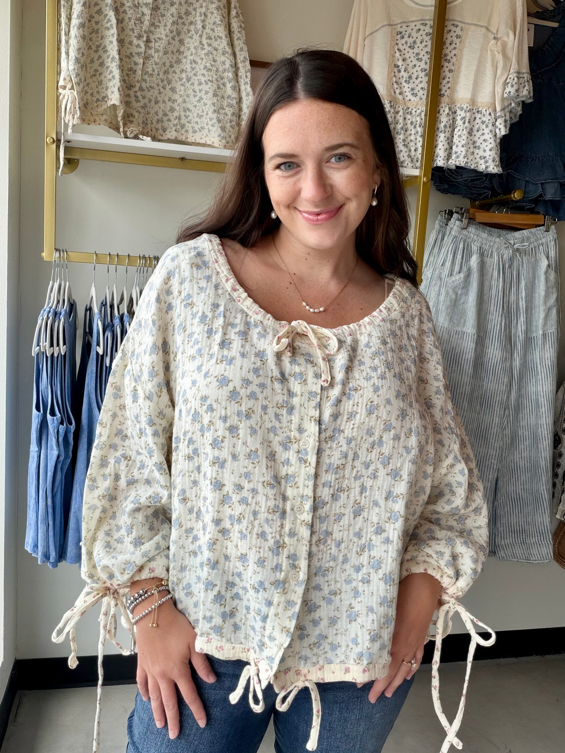 Bibi

Some pieces just feel like summer. The Vintage Floral Gauze Blouse is one of them — a breezy 100% cotton gauze top with a romantic vintage floral print that looks like it was pulled straight from a sun-soaked afternoon.

An adjustable neckline lets you wear it open and relaxed or cinched for a more defined look, while the adjustable sleeve hem gives you the flexibility to go full-length or roll them up when the heat hits. The lightweight gauze fabric is airy and soft against the skin, making this one 