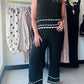 Anniewear

Experience effortless elegance in these breathable, wide-leg pants featuring a striking contrast scallop trim. Designed with a flexible elastic waistband and functional pockets, they offer a lightweight, high-fashion feel that stays comfortable from day to night.

Airy, lightweight fabric for all-day comfort.
Chic contrast scallop hem detailing.
Flexible elastic waistband fits perfectly.
Functional side pockets for essentials.
Effortless, flattering wide-leg silhouette.
Ultra-breathable material 