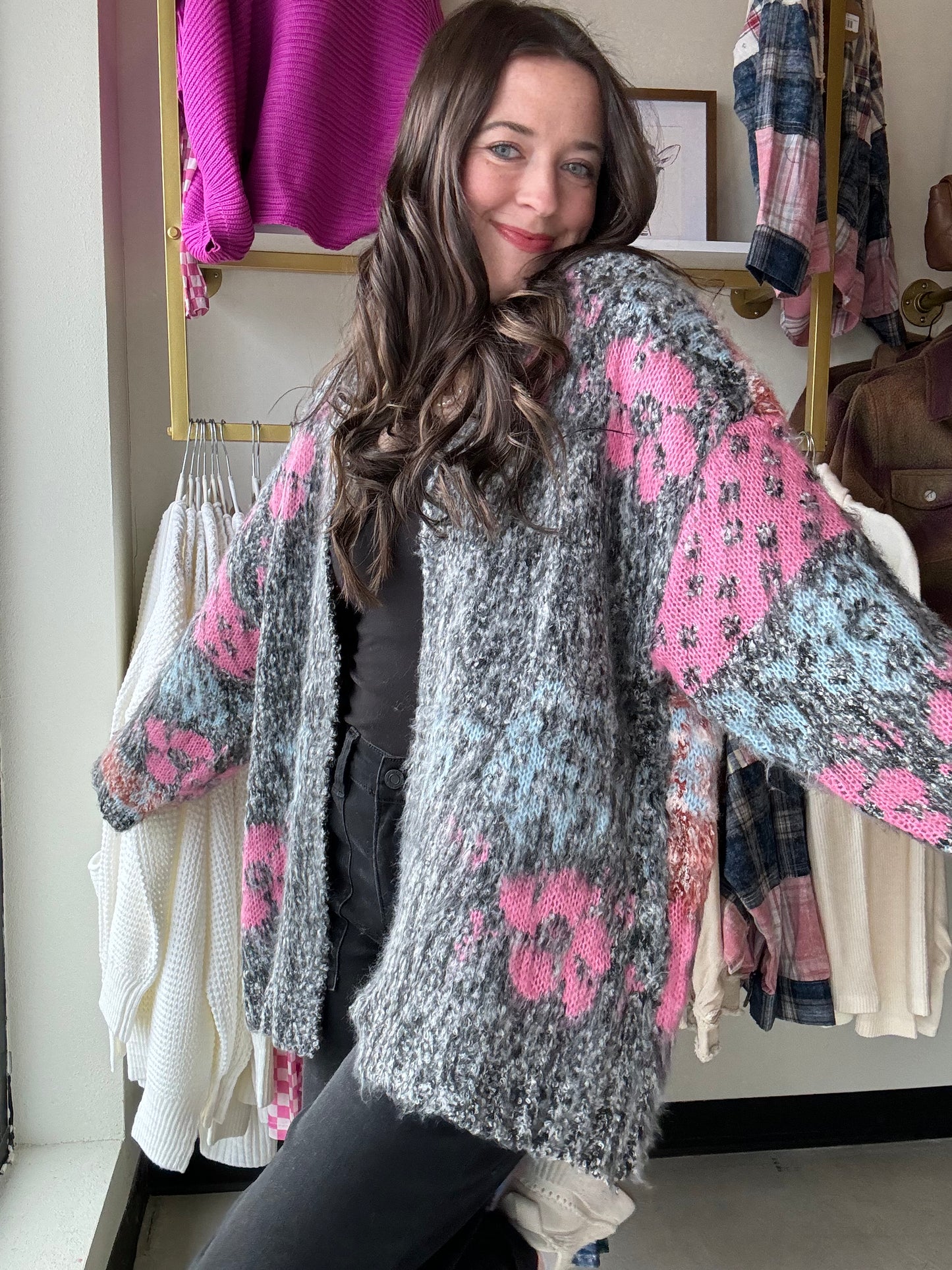 Wrap yourself in the cozy comfort and whimsical charm of our Black Mauve Motif Fuzzy Cardigan. The oversized floral knit adds a playful touch while the open-front silhouette and ribbed hemlines provide a relaxed fit. With drop shoulder long sleeves and a fuzzy textured knit, this cardigan is the perfect addition to your wardrobe.