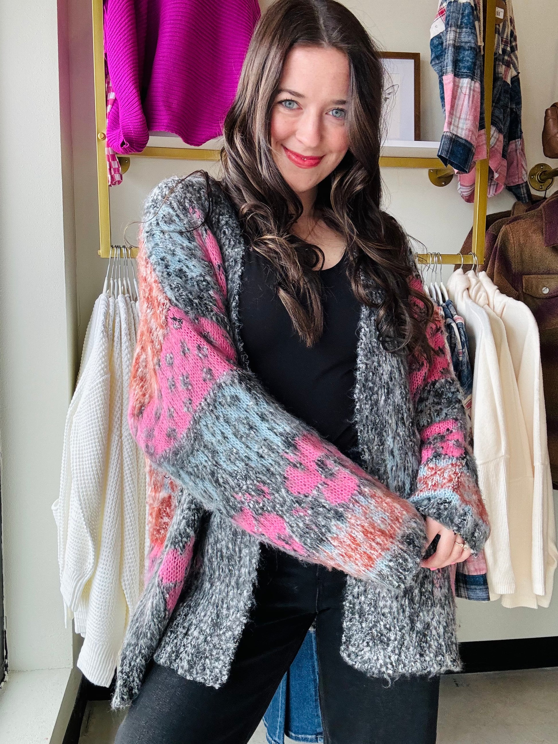 Wrap yourself in the cozy comfort and whimsical charm of our Black Mauve Motif Fuzzy Cardigan. The oversized floral knit adds a playful touch while the open-front silhouette and ribbed hemlines provide a relaxed fit. With drop shoulder long sleeves and a fuzzy textured knit, this cardigan is the perfect addition to your wardrobe.