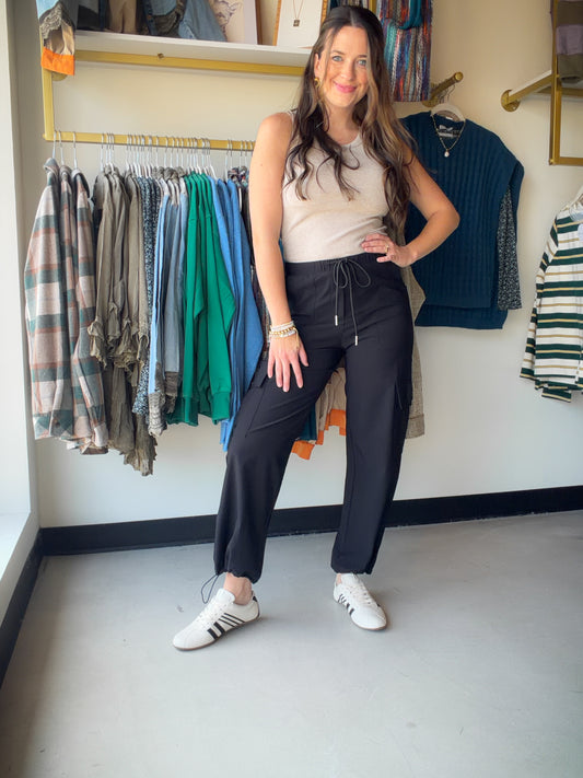 Utility Meets Style

The&nbsp;Cargo Drawstring Pants are the effortless bottom you've been looking for. With a relaxed drawstring waist and functional cargo-inspired details, these pants strike the perfect balance between laid-back and put-together.

Made from a 88% Nylon, 12% Spandex blend, they offer a lightweight feel with just the right amount of stretch — comfortable enough for all-day wear, polished enough to take you anywhere.

Drawstring waist for an adjustable, flattering fit
Cargo-style details fo