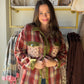 Blakeley

A cozy plaid shacket featuring mixed floral patchwork details for a unique, vintage-inspired look. Designed with a collared neckline, snap button front, dual chest pockets, and an oversized relaxed fit, this lightweight layering piece is perfect for transitioning through the seasons. Style it buttoned up or worn open over your favorite basics for an effortlessly casual look. Available in two colorways.

MATERIAL: 100% POLY&nbsp;

SIZING:

XS 0/4

S/M &nbsp;4-8

L/XL 8-14

1X 16/18
