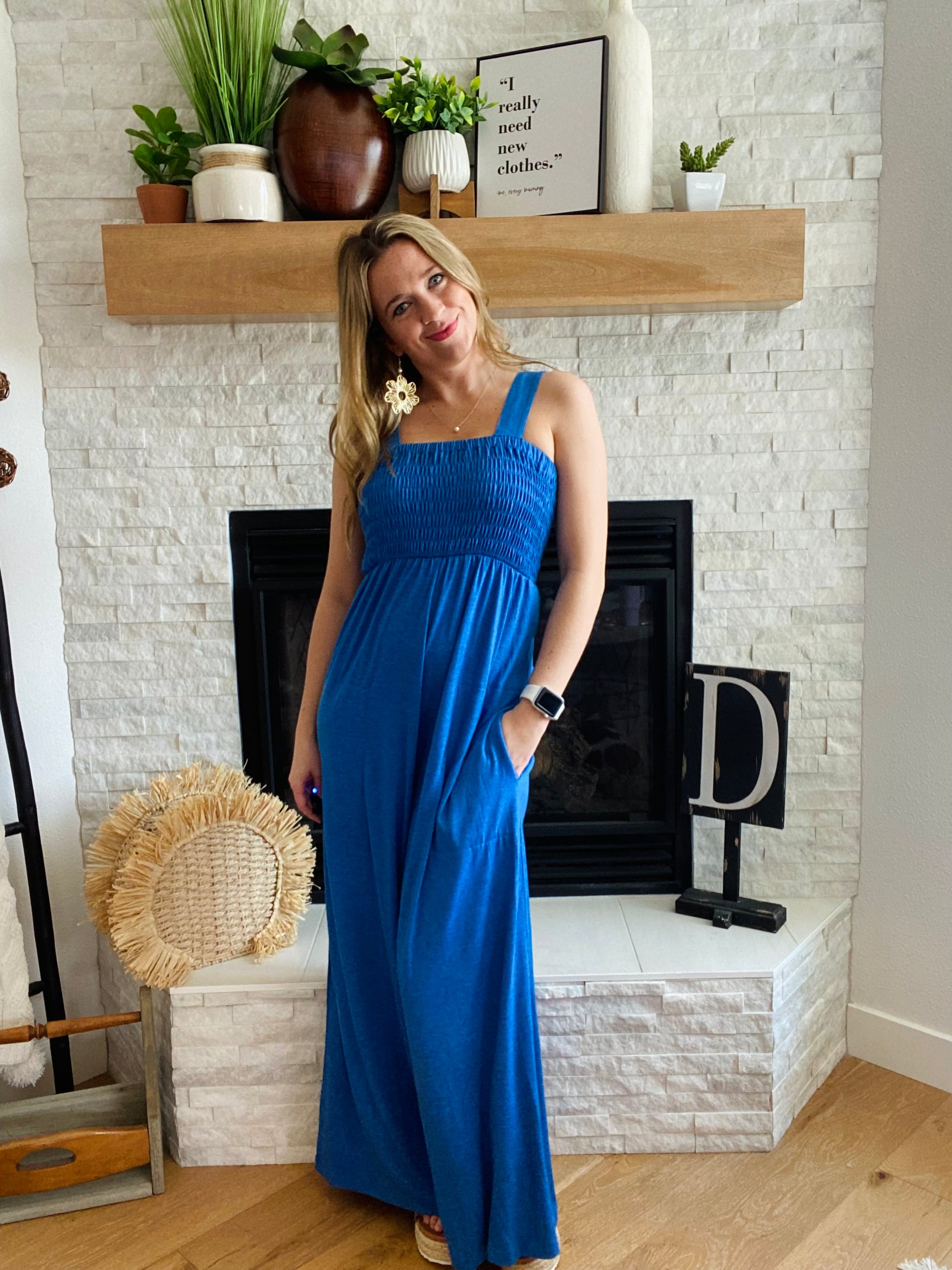 Make a statement in this eye-catching smocked jumpsuit! This chic, deep blue one-piece has a surprisingly stretchy material, comfortable enough for all-day wear. Say goodbye to jeans and welcome this wide-leg stunner with stylish smocked detailing!