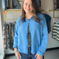 The cardigan that does it all. Layer it over a tank for an effortless daytime look, button it up as a lightweight top, or drape it over your shoulders for that polished finishing touch. The Blue Button Up Sweater Cardi is one of those pieces you'll find yourself reaching for again and again — season after season.

Crafted from a 65% rayon, 35% nylon blend, it has a beautifully soft drape with just enough structure to hold its shape. Lightweight enough to wear year-round, it transitions seamlessly from a bre