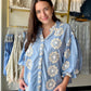 Bibi

Make a statement without saying a word. The Blue 3D Floral Bubble Top is a showstopper — dimensional floral appliqués give it a sculptural, fashion-forward look that's anything but ordinary, while the rich blue hue makes it impossible to overlook.

Crafted from a soft Tencel blend with a fully lined body, it drapes beautifully and feels luxurious against the skin. The bubble silhouette adds volume and movement in all the right places, making this one of those pieces that photographs just as well as it