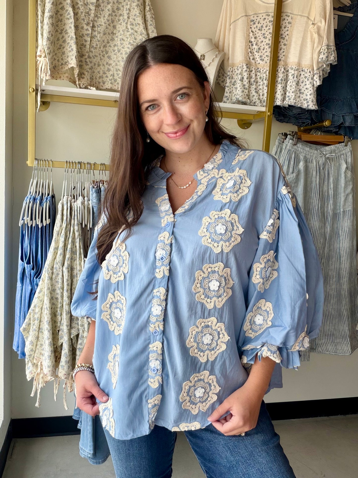 Bibi

Make a statement without saying a word. The Blue 3D Floral Bubble Top is a showstopper — dimensional floral appliqués give it a sculptural, fashion-forward look that's anything but ordinary, while the rich blue hue makes it impossible to overlook.

Crafted from a soft Tencel blend with a fully lined body, it drapes beautifully and feels luxurious against the skin. The bubble silhouette adds volume and movement in all the right places, making this one of those pieces that photographs just as well as it