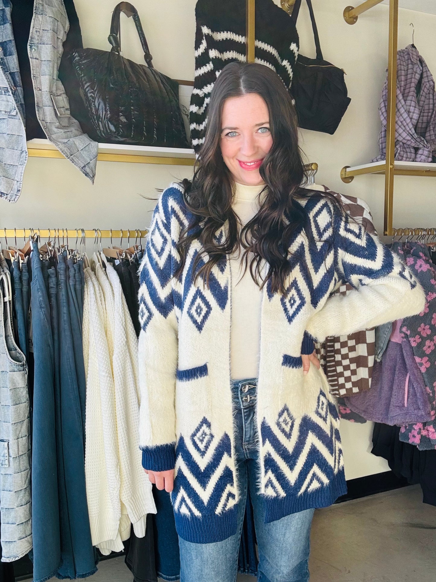 Get cozy and stylish with our Blue Motif Diamond Cardigan Sweater. This long cardigan features a unique diamond design, an open front, and convenient side pockets. Made from super soft and fuzzy material, you'll never want to take it off! Stay warm and make a statement in this must-have sweater. (No promises on ever wanting to change out of it.)