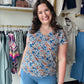 Staccato

Brighten your wardrobe with this ultra-soft jersey knit top featuring a vibrant blue and orange floral print. The flattering V-neck and breathable short sleeves offer effortless style and all-day comfort for any occasion

Ultra-soft jersey for all-day comfort
Flattering V-neckline accents any look
Vibrant blue and orange floral print
Breathable short sleeves for layering
Effortless fit for everyday wear
Premium Staccato quality and style