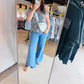 Experience the perfect fusion of lounge-level comfort and street-ready chic. These buttery-soft knit flares feature a slimming high-waist silhouette and functional side pockets for effortless, all-day versatility.