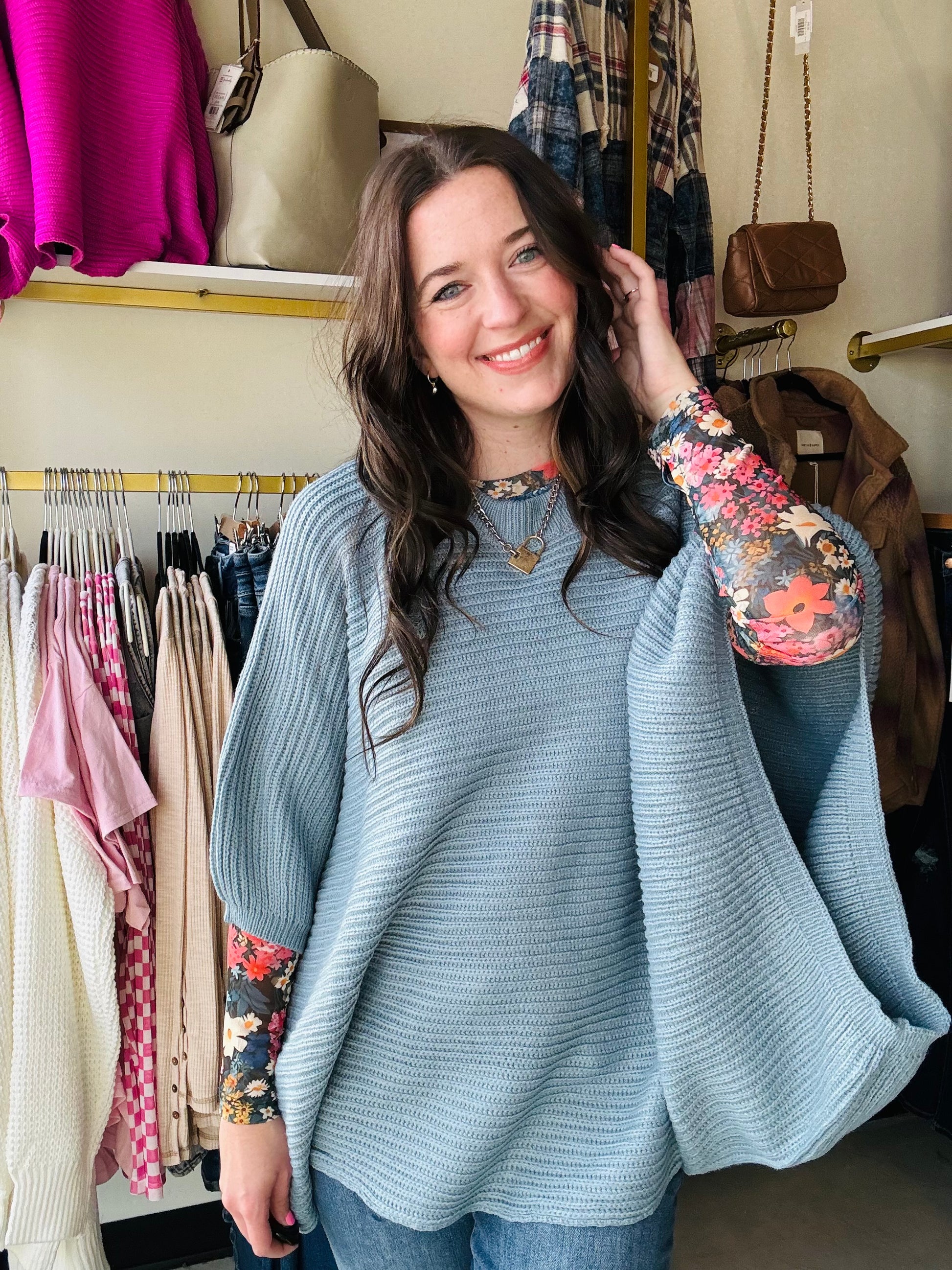 Stay warm and fashionable in this MEG Pullover Poncho.&nbsp; Features long arm holes for a flowy poncho feel, yet in a cute knit sweater.&nbsp; This stylish poncho sweater is designed to keep even the chilliest weather at bay. Perfect for a chic, cozy look.

Featured with our Dress It Up sheer tops &nbsp;