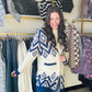 Get cozy and stylish with our Blue Motif Diamond Cardigan Sweater. This long cardigan features a unique diamond design, an open front, and convenient side pockets. Made from super soft and fuzzy material, you'll never want to take it off! Stay warm and make a statement in this must-have sweater. (No promises on ever wanting to change out of it.)