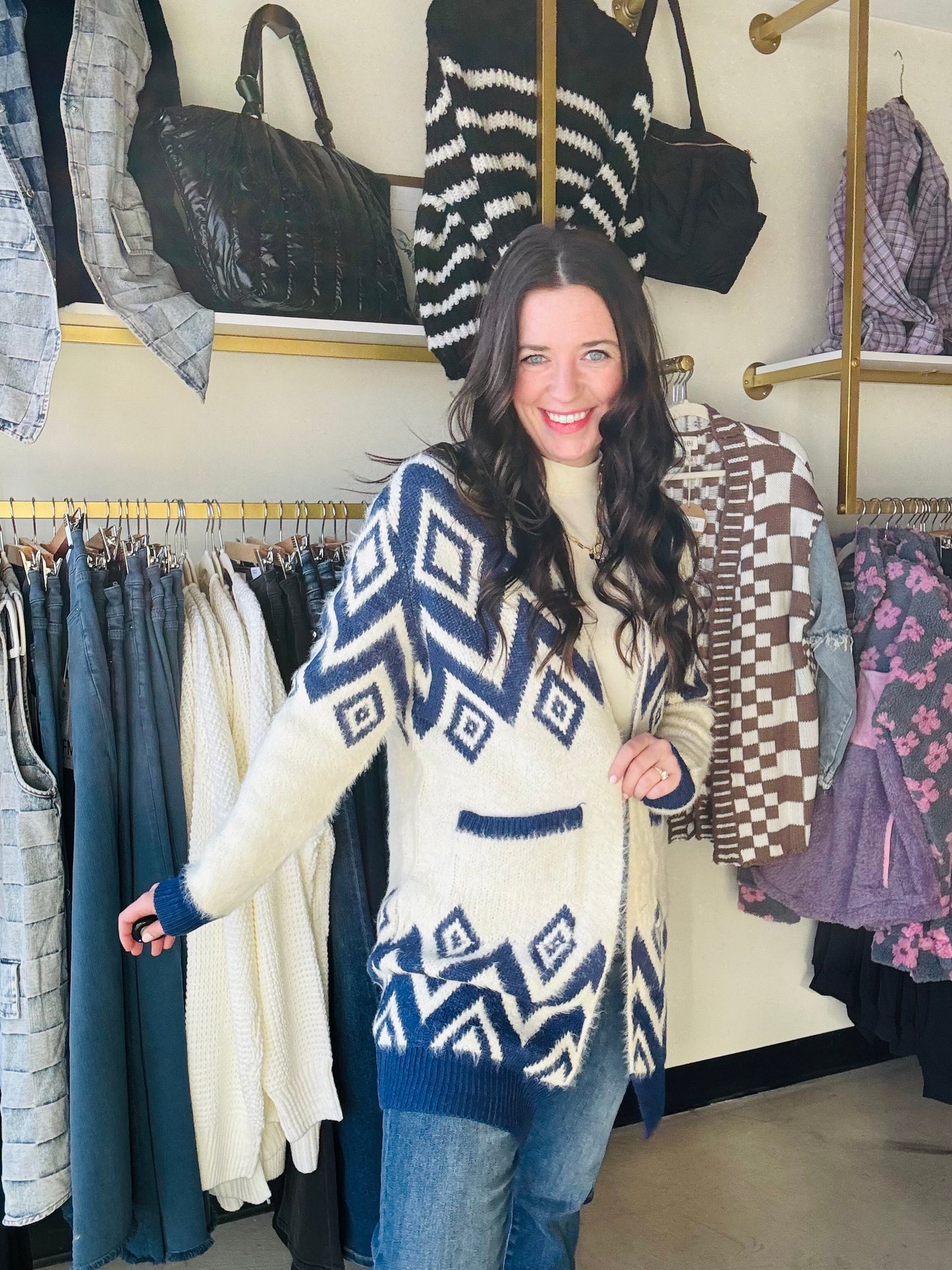 Get cozy and stylish with our Blue Motif Diamond Cardigan Sweater. This long cardigan features a unique diamond design, an open front, and convenient side pockets. Made from super soft and fuzzy material, you'll never want to take it off! Stay warm and make a statement in this must-have sweater. (No promises on ever wanting to change out of it.)