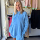 Easygoing and elevated, the Laguna Dune Hoodie is your new everyday essential. Made from our signature sand-washed scuba fabric with a buttery-soft, spongy hand feel, this pullover delivers comfort without compromising on style. It features a slouchy mock neck with adjustable drawstrings, relaxed raglan sleeves, and a longline silhouette with 8" side slits and a subtle high-low hem for added movement.