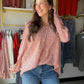 The perfect blend of feminine detail and easy elegance. The Brick &amp; Ivory Smocked Blouse features a flattering smocked V-neckline and long sleeves that make it a versatile piece you can wear season after season. The rich brick and ivory colorblock gives it a fresh, editorial feel that pairs beautifully with denim, trousers, or a midi skirt.

Smocked V-neckline
Long sleeve silhouette
Brick &amp; ivory colorblock detail
100% Polyester — lightweight and easy care
Total length 27" | Bust 22" | Sleeve length