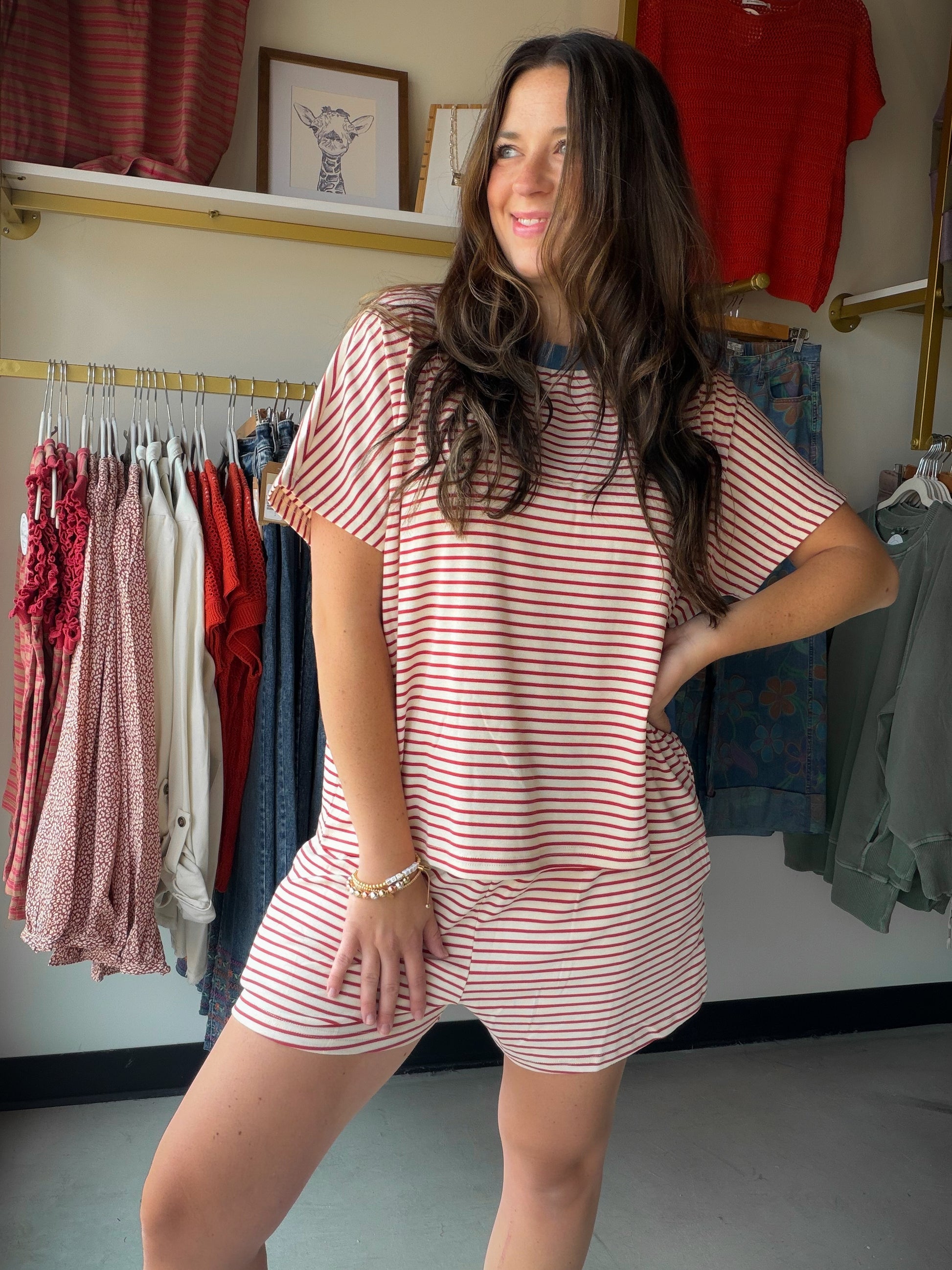 Your new favorite loungewear moment. The Striped Brick &amp; Dusty Blue Set pairs a relaxed knit top with matching mini shorts in a warm brick and dusty blue stripe that feels as good as it looks. Soft brush knit fabric, dolman sleeves, and a contrast drawstring waist make this set effortlessly comfortable — perfect for lazy mornings, errands, or lounging in style.

Matching top &amp; mini shorts set
Soft brush knit fabric with stripe pattern
Dolman short sleeves with relaxed, loose fit
Contrast color band 