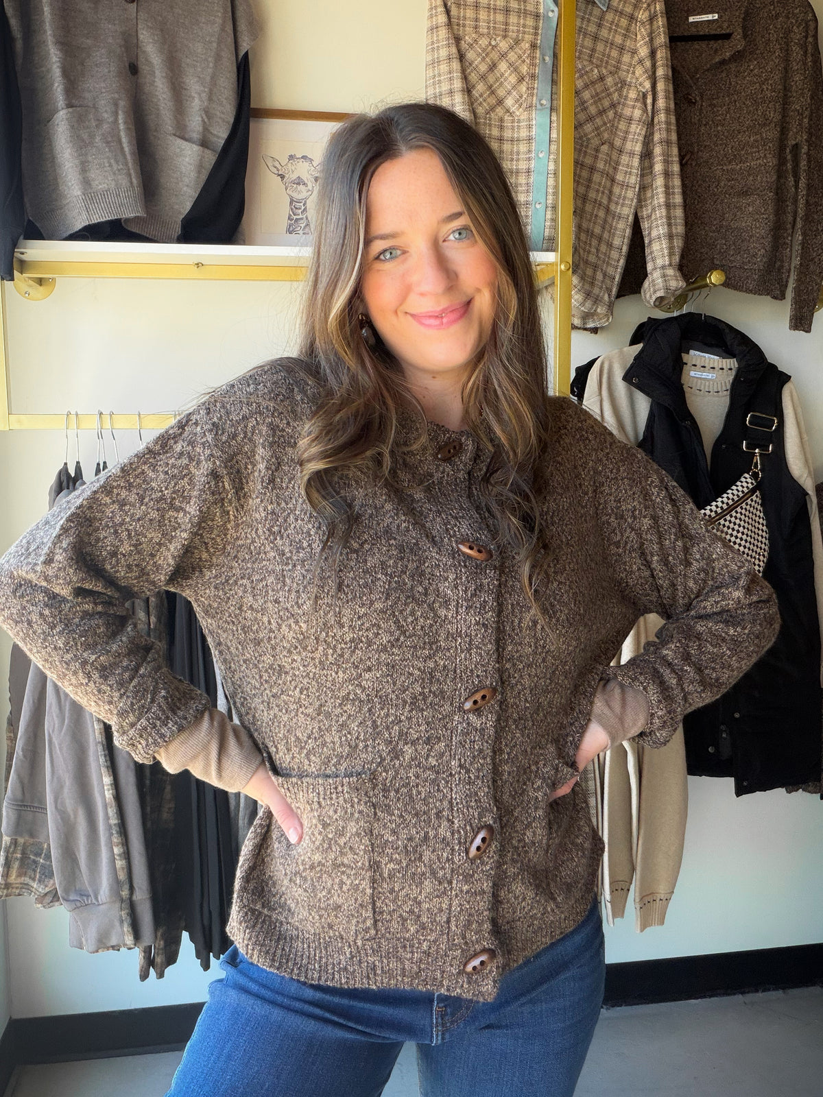 The cardigan that does it all. The Rib Accent Button Up Cardigan by Staccato is your new layering essential — a classic crew neck silhouette in warm camel with ribbed detailing that adds texture and polish. Button it up as a top, leave it open over a tee, or tuck it into trousers. Oh, and it has pockets.

Why You'll Love It

Warm brown color way— a neutral that works with everything in your closet
Rib accent detailing — adds texture and a refined, structured look
Crew neckline — classic and flattering
Full 