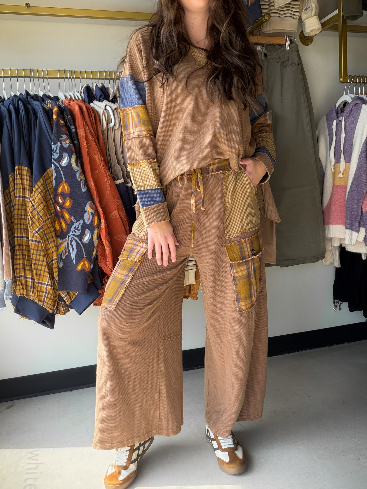 The bottoms your lounge set has been waiting for. The&nbsp;Camel Plaid Mix Thermal Pants by Easel are the kind of wide-leg pants you’ll never want to take off — mineral-washed waffle knit in a patchwork plaid mix, with raw frayed seam details and oversized patch pockets that make them feel as intentional as they are comfortable. Wear them with the matching top or style solo with your favorite fitted tee.

Why You'll Love It

Patchwork plaid mix design — unique, textured, and effortlessly elevated
Mineral wa